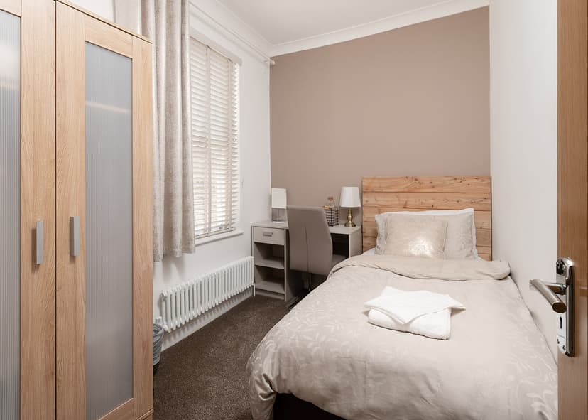 Cozy bedroom corner with reading area in London